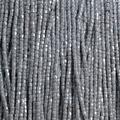 Close-up of strung Preciosa 9/0 three-cut glass seed beads in opaque grey with a luster finish