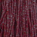Close-up of strung Preciosa 9/0 three-cut glass seed beads in opaque red with a luster finish