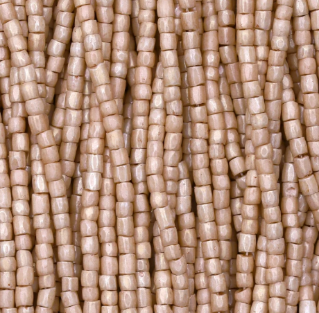 Close-up of strung Preciosa 9/0 three-cut glass seed beads in opaque rose terra with a luster finish