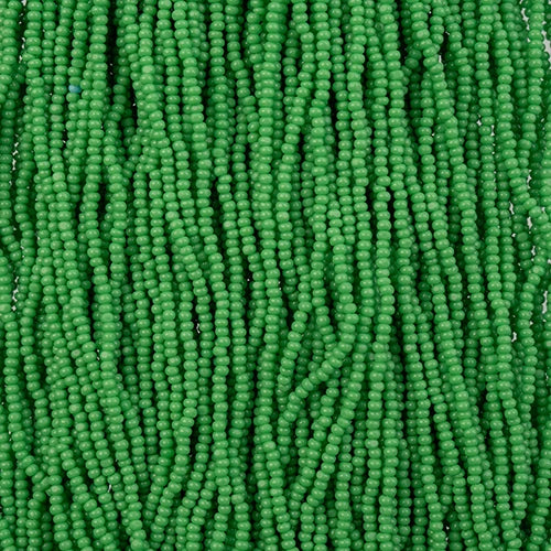 Close-up of strung Preciosa 13/0 true cut charlotte beads in opaque medium green