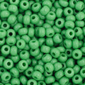 Close-up of Preciosa 11/0 Czech glass seed beads in opaque medium green