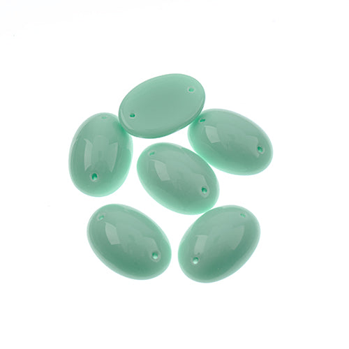 Five 13 x 18mm Czech glass oval cabs in opaque mint on a white background