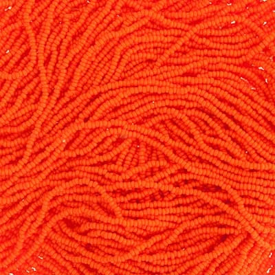 Close-up of strung Preciosa 13/0 true cut charlotte beads in opaque orange
