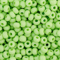 Close-up of Preciosa 11/0 Czech glass seed beads in opaque pale green