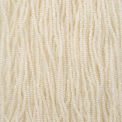 Close-up of strung Preciosa 13/0 true cut charlotte beads in opaque pearl ceylon