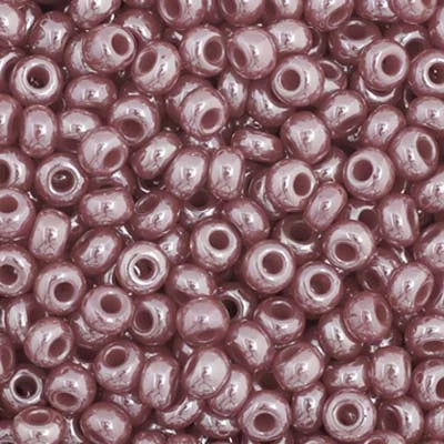 Close-up of Preciosa 11/0 Czech glass seed beads in opaque red with a luster finish