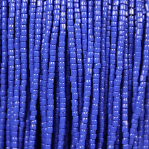 Close-up of strung Preciosa 9/0 three-cut glass seed beads in opaque royal blue