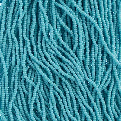 Close-up of strung Preciosa 13/0 true cut charlotte beads in opaque turquoise blue