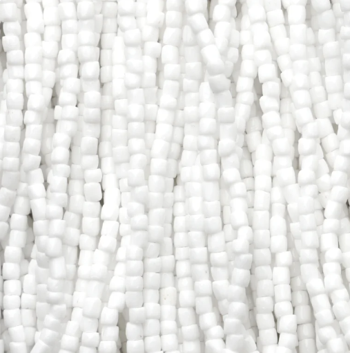Close-up of strung Preciosa 9/0 three-cut glass seed beads in opaque white