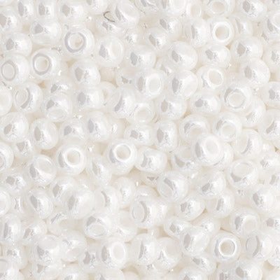 Close-up of Preciosa 11/0 Czech glass seed beads in opaque white with a luster finish