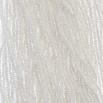 Close-up of strung Preciosa 13/0 true cut charlotte beads in opaque white