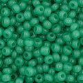 Close-up of Preciosa 11/0 Czech glass seed beads in opaque green