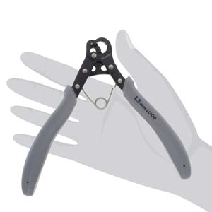 Hand holding the 1 Step Looper to show its size and grip, against a light background