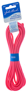 Neon pink paracord bundle with a blue card label on a white background