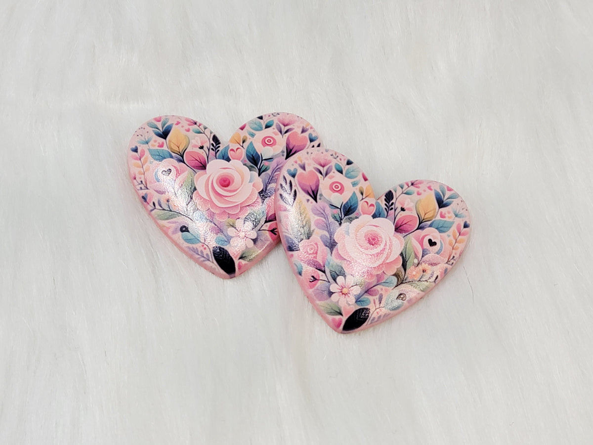 Pair of 37mm resin heart cabochons (cabs) in pink with pastel roses and dark leaves