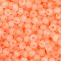 Close-up of Preciosa 11/0 Czech glass seed beads in pearl peach with an AB rainbow finish