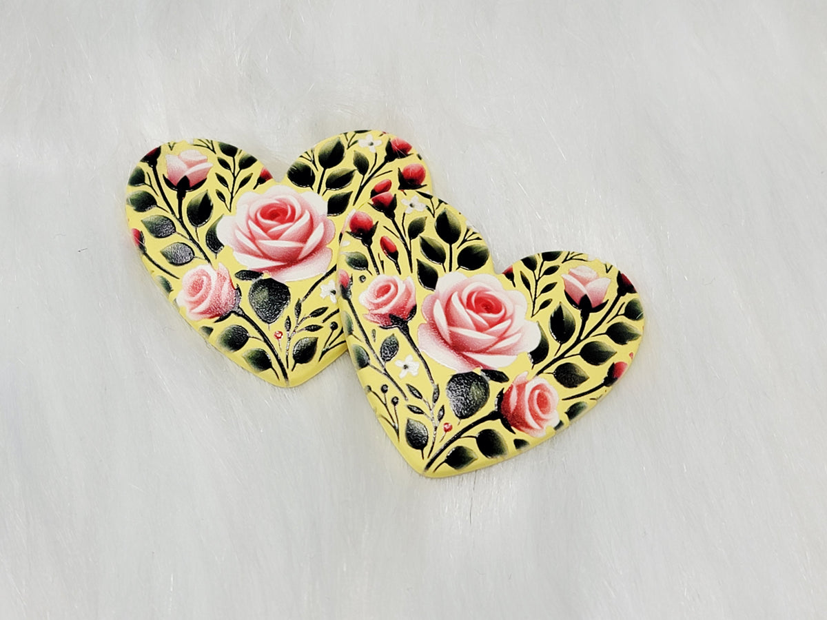 Pair of 37mm resin heart cabochons (cabs) in yellow with pink roses on black vines