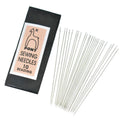 Package of 25 long size 10 pony needles fanned out beside their black sleeve