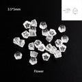 Clear 3.5 x 5mm flower-shaped rubber earring backs on black, with a size label
