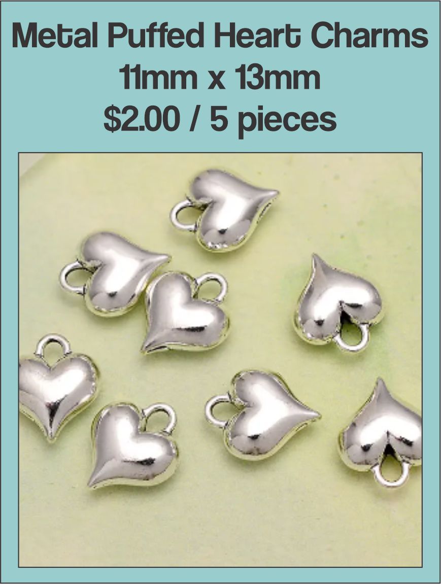 Silver-tone 11 x 13mm puffed heart charms with loops, five shown on a white background