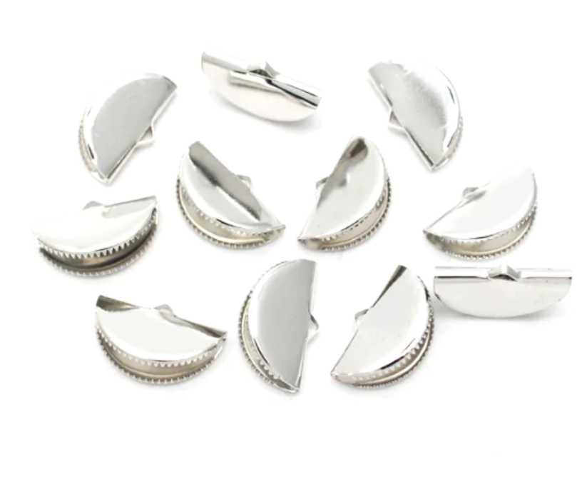 Pile of rhodium pinch crimp ends in 13mm and 20mm sizes on a white background
