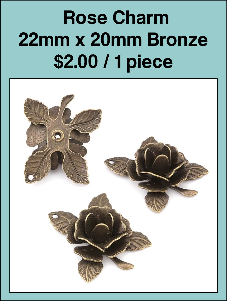 Bronze-tone 22 x 20mm rose charms shown from the front and back
