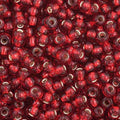 Close-up of Preciosa 11/0 Czech glass seed beads in opaque silverlined medium red