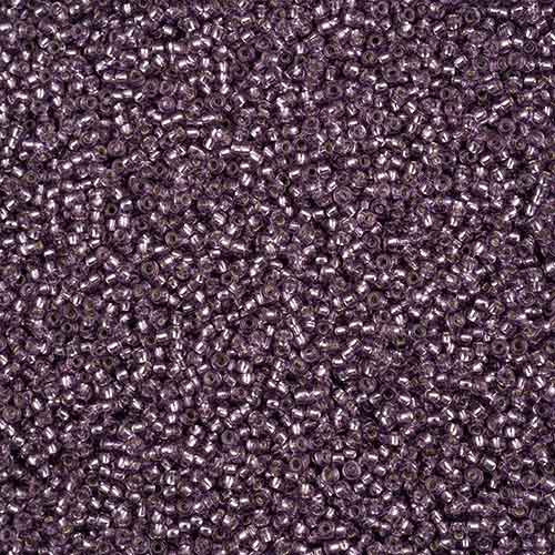 Close-up of Preciosa 11/0 Czech glass seed beads in silver-lined orchid solgel
