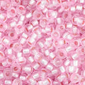 Close-up of Preciosa 11/0 Czech glass seed beads in dyed silver-lined pink