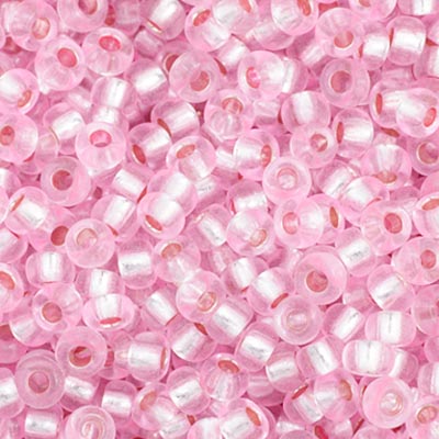 Close-up of Preciosa 11/0 Czech glass seed beads in dyed silver-lined pink