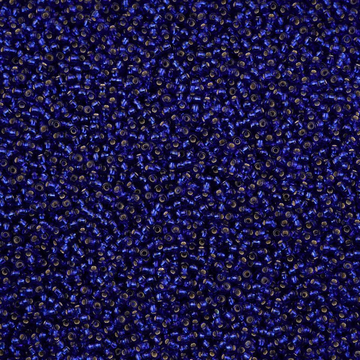Close-up of Preciosa 11/0 Czech glass seed beads in silver-lined sapphire