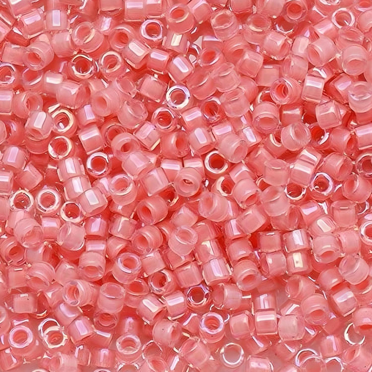 Close-up of Miyuki Delica 11/0 DB0902 cylinder beads in shimmering rose crystal lined