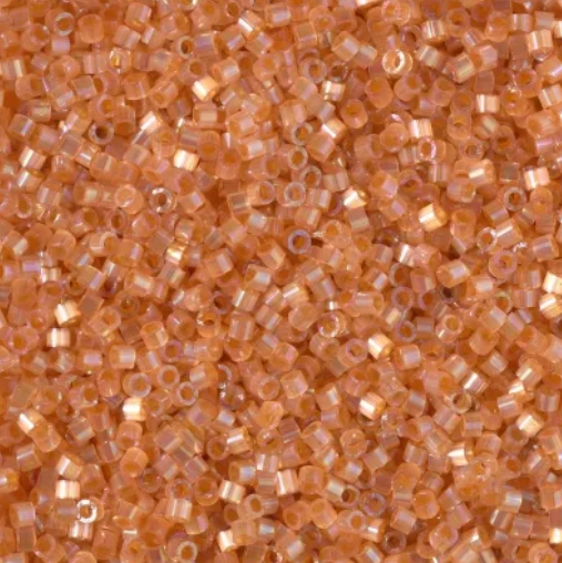 Close-up of Miyuki Delica 11/0 DB1864 cylinder beads in dyed inside topaz with an AB silk satin finish