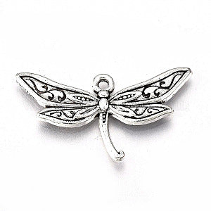 Silver-tone 17 x 31.5mm dragonfly charm with detailed wings on a white background
