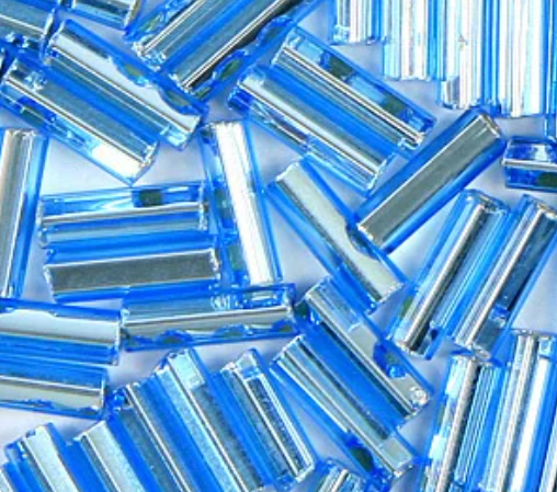Close-up of loose 6mm Preciosa Czech glass bugle beads in silver-lined aqua