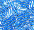 Close-up of loose twisted 6mm Preciosa Czech glass bugle beads in silver-lined aqua