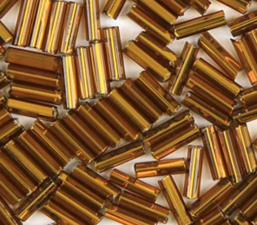 Close-up of loose 6mm Preciosa Czech glass bugle beads in silver-lined brown