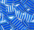 Close-up of loose 6mm Preciosa Czech glass bugle beads in silver-lined dark aqua