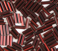 Close-up of loose 6mm Preciosa Czech glass bugle beads in silver-lined dark red