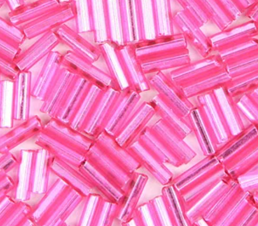 Close-up of loose 6mm Preciosa Czech glass bugle beads in dyed silver-lined fuchsia