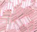 Close-up of loose 6mm Preciosa Czech glass bugle beads in dyed silver-lined pink