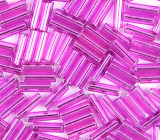 Close-up of loose 6mm Preciosa Czech glass bugle beads in dyed silver-lined purple
