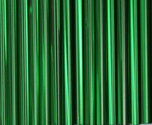 Rows of 30mm Preciosa Czech glass bugle beads in silver-lined emerald