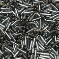 Close-up of loose 6mm Preciosa Czech glass bugle beads in silver-lined grey