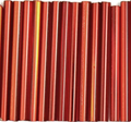 Rows of 30mm Preciosa Czech glass bugle beads in silver-lined light red