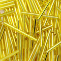 Rows of 30mm Preciosa Czech glass bugle beads in silver-lined light yellow