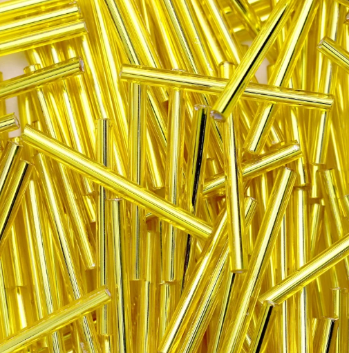 Rows of 30mm Preciosa Czech glass bugle beads in silver-lined light yellow