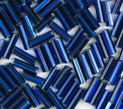 Close-up of loose 6mm Preciosa Czech glass bugle beads in silver-lined montana blue