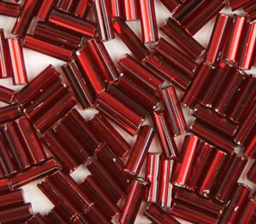 Close-up of loose 6mm Preciosa Czech glass bugle beads in silver-lined red