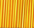 Rows of 30mm Preciosa Czech glass bugle beads in silver-lined light orange
